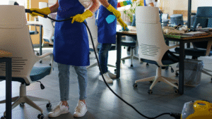 Janitorial team using steam equipment to clean Chicago office space