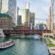 Chicago River with tour boat and downtown high-rises on a sunny summer day