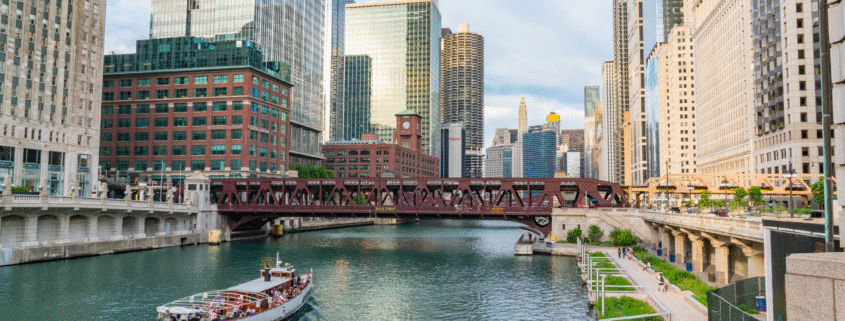 Chicago River with tour boat and downtown high-rises on a sunny summer day