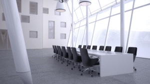 Large modern conference room with glass walls and black chairs