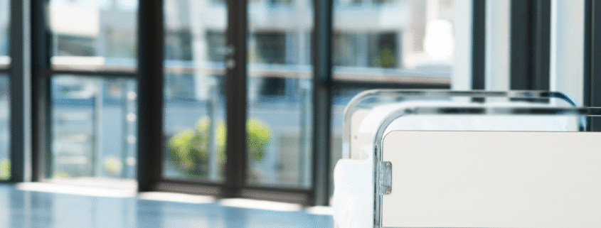 Hospital bed in clean, sunlit medical facility