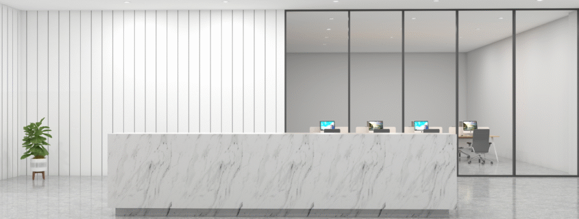 Clean and minimalist office reception with marble counter and glass wall.