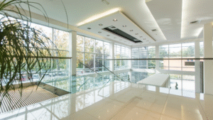 Modern office building with glass features and reflective white floors.