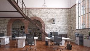 Spacious open-plan office with industrial-style brick and stone walls.