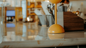 Polished marble counter reflecting light in a retail setting.