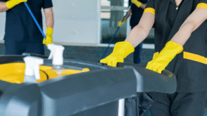 Janitorial staff using cleaning carts and tools during routine maintenance.