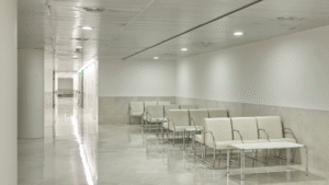 Clean hospital waiting area with polished floors and seating.