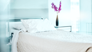 Clean patient room with flowers adding comfort and calm.