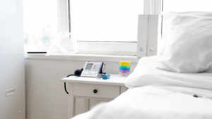 Sanitized bedside table with medical devices neatly arranged.