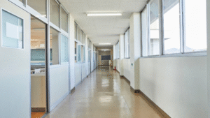 Clean and bright school hallway with polished floors and natural light.