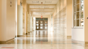 Bright school corridor with polished floors and lockers.