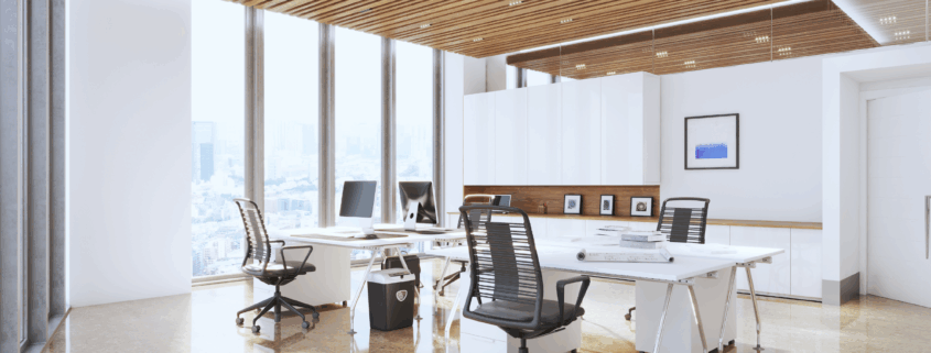 Bright executive office with large windows, clean floors, and city view