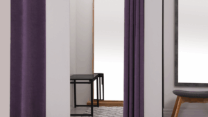 Retail fitting room with curtains, bench, and mirror