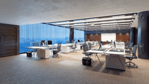 Open-plan office with city views and evenly spaced workstations