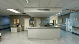 Bright hospital duty station with clear floors and organized workspaces