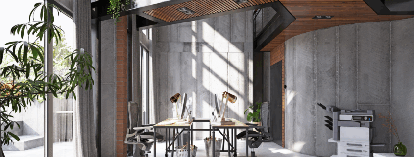 Modern open office with clean desks, natural lighting, and organized work areas.