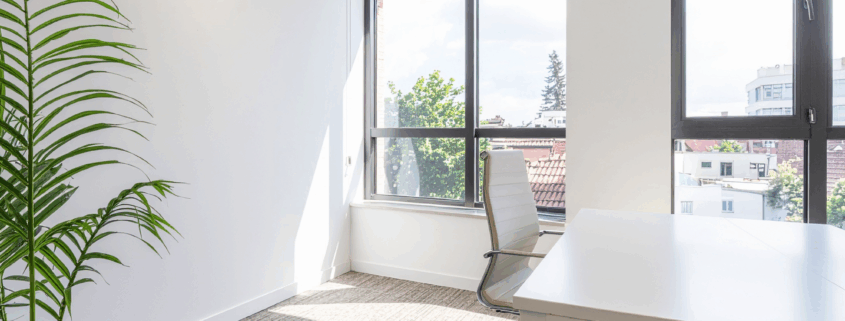 Clean office windows bringing natural light into the workspace