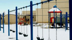 Snow-covered school playground during winter months