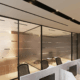 Modern office interior with glass walls and branded signage in a clean professional environment