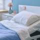 Clean hospital patient room with fresh bedding and calm lighting
