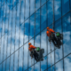 Clean exterior glass reflecting sky and surroundings on a commercial building