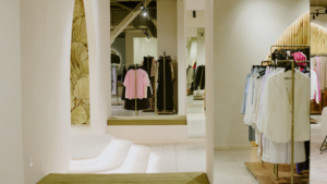Elegant boutique fitting area with mirrors, soft lighting, and organized clothing displays supported by Chicago's Professional Retail Cleaning.