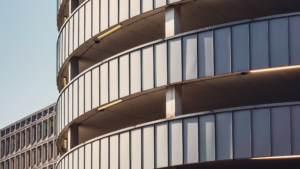 Commercial building exterior with glass panels and structural design