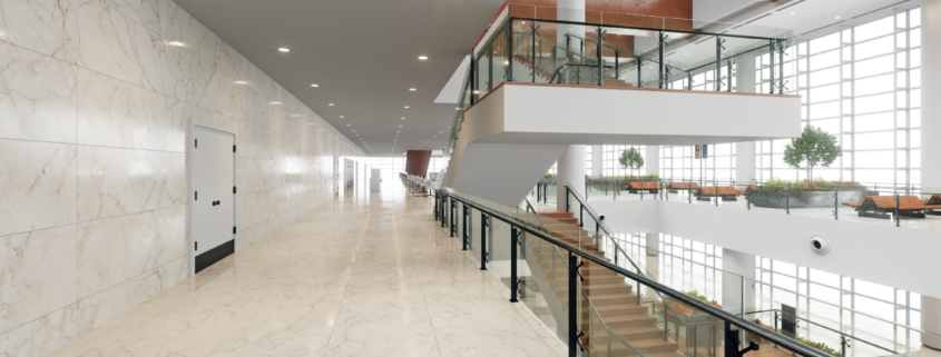 Modern multi-level commercial interior with walkways, railings, and open space