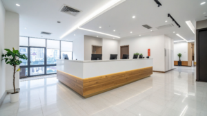 Bright modern office reception area with front desk and clean tile flooring