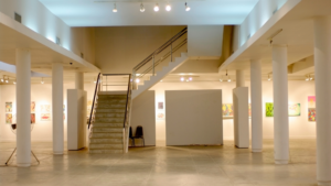 Contemporary office reception desk with large windows and natural light
