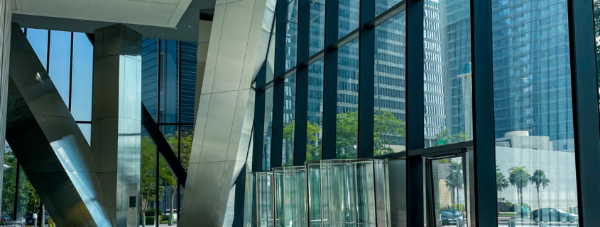 Modern glass lobby with large windows and city view maintained by Professional Window Cleaning in Chicago