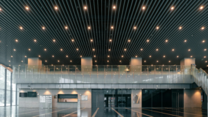 Modern commercial lobby with high ceilings, lighting, and polished floors