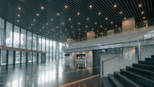 Professional Facility Maintenance in Chicago maintaining large open lobby with stairs and glass walls