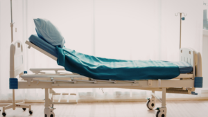 Hospital bed with clean sheets in a controlled clinical environment