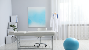 Physical therapy room with treatment table and equipment