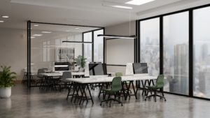 Modern office workspace with desks and large windows