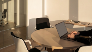 Meeting room with laptop and clean table ready for use