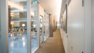 Best Janitorial Services Chicago maintaining clean office hallway and glass partitions
