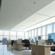 Commercial office with floor-to-ceiling clean windows and bright natural light.