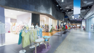 Modern shopping center with clean storefronts, polished floors, and organized retail displays.