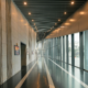 Clean commercial hallway with polished floors and natural light