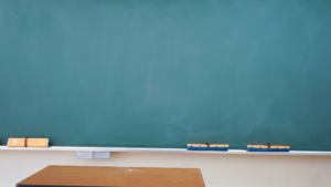 Well-maintained classroom with rows of desks, chairs, and clean floors.