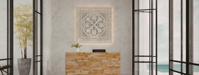 Modern commercial reception area with marble walls, wood reception desk, large windows, and decorative lighting.