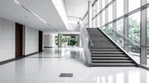 Professional office space with large windows, executive desk, and modern furnishings.