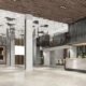 Modern commercial lobby with reception desk, high ceilings, architectural lighting, and polished flooring after professional cleaning.