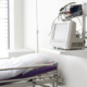 Hospital patient room with monitoring equipment and medical devices near a hospital bed