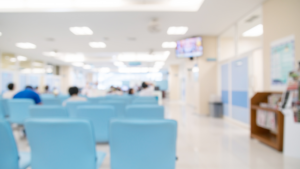 Clean hospital common area with open floor space and healthcare reception desk