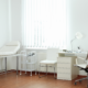 Healthcare Medical Cleaning in a clean medical exam room with examination table and workstation