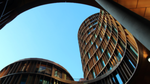 Modern commercial office building with contemporary architecture and curved exterior.