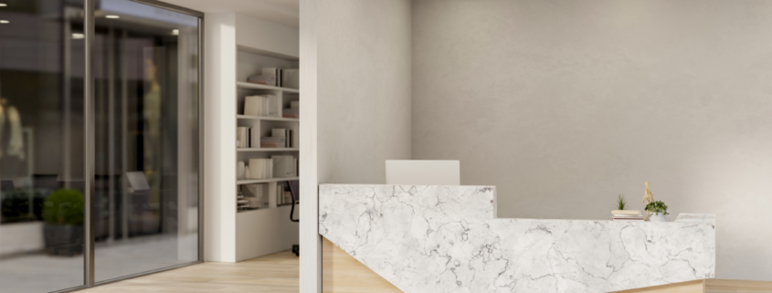 Bright commercial office with clean workstations, polished floors, and organized desks.
